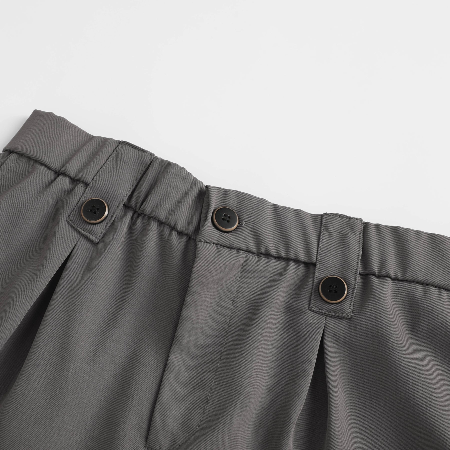 Double pleat and waistband button detail