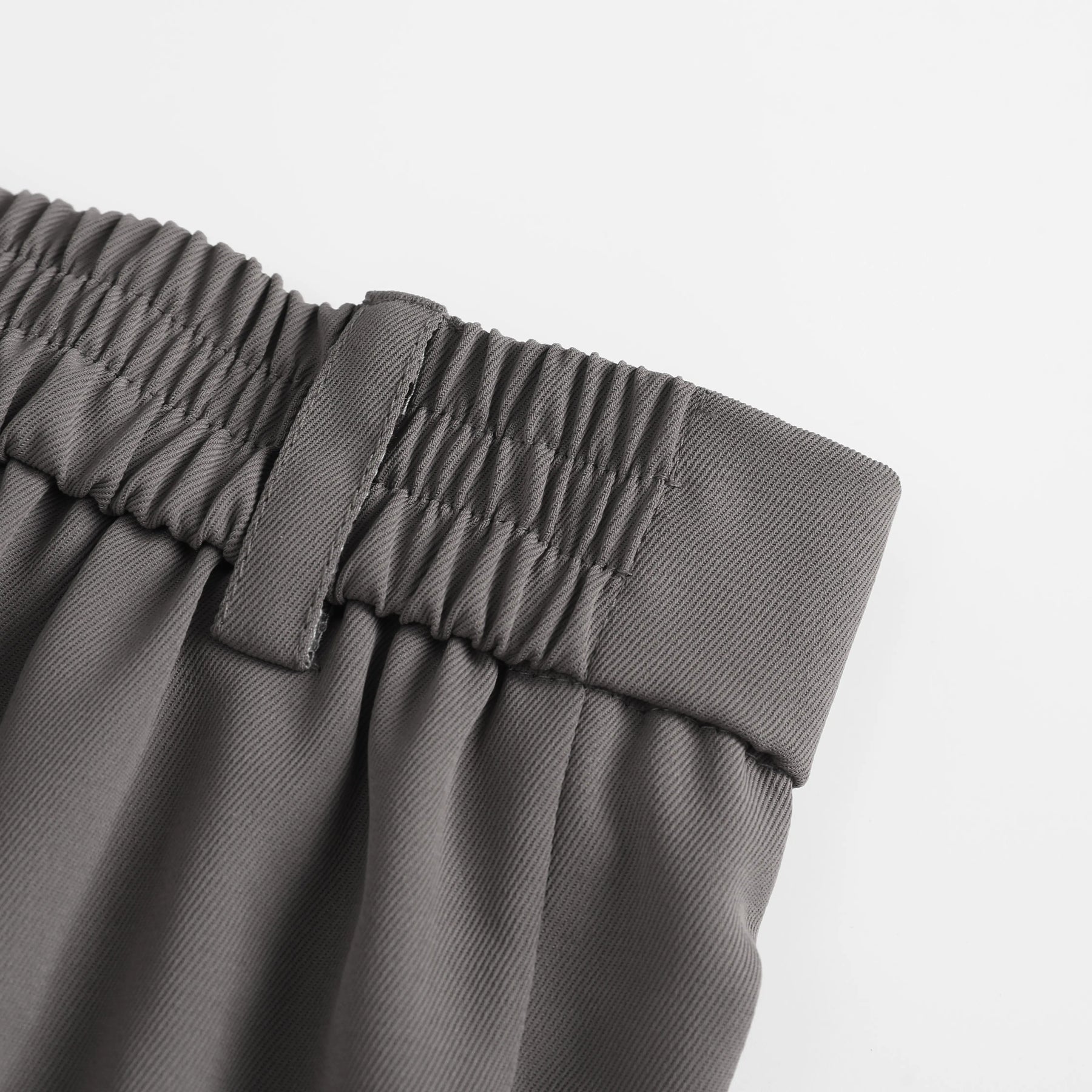 Elasticated rear waistband detail on pleated shorts